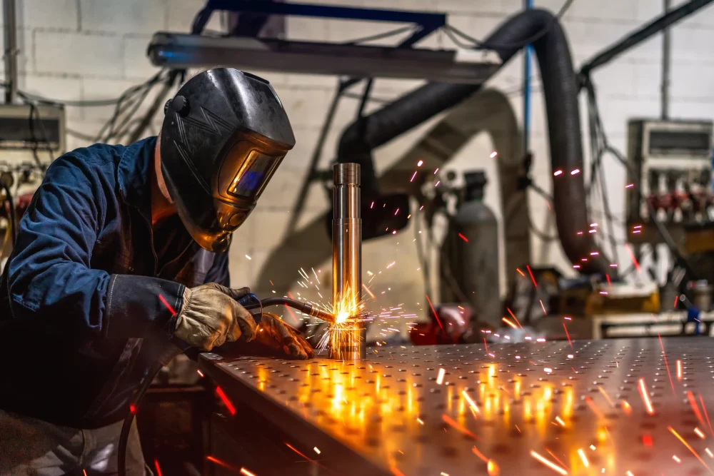 welder-welding-a-piece-of-metal-in-a-factory-2024-12-10-03-23-59-utc